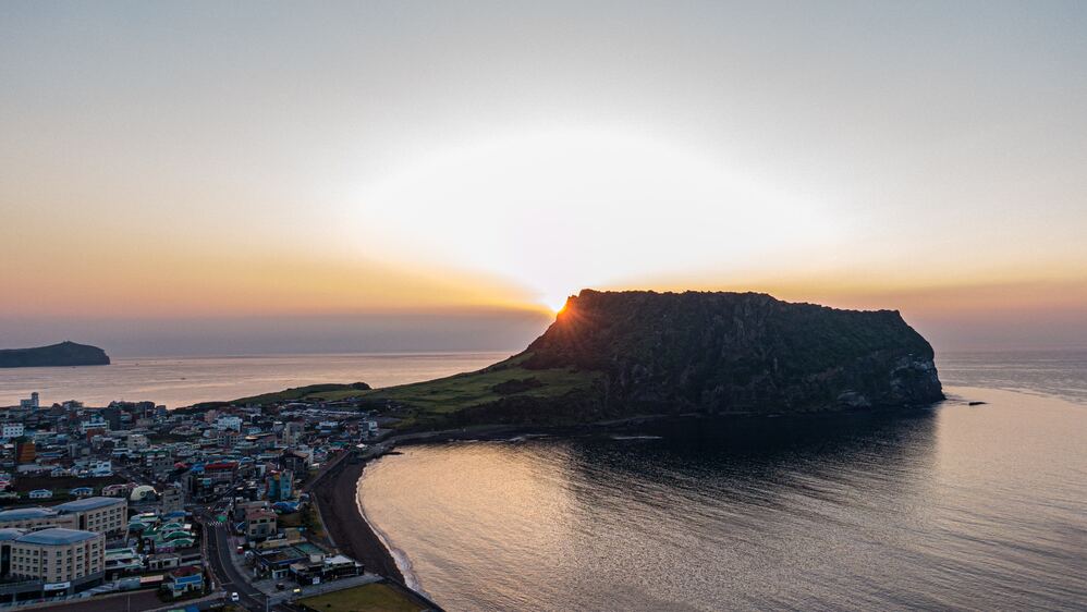 Seongsan Ilchulbong, Iconic Jeju Island Attraction Offering Breathtaking Views and Unique Landscape.