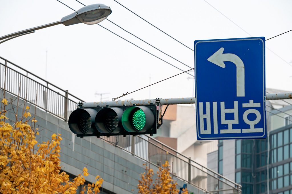 Navigate Jeju Island Safely with Clear Traffic Signs and Signals, Essential for Jeju Car Rental.