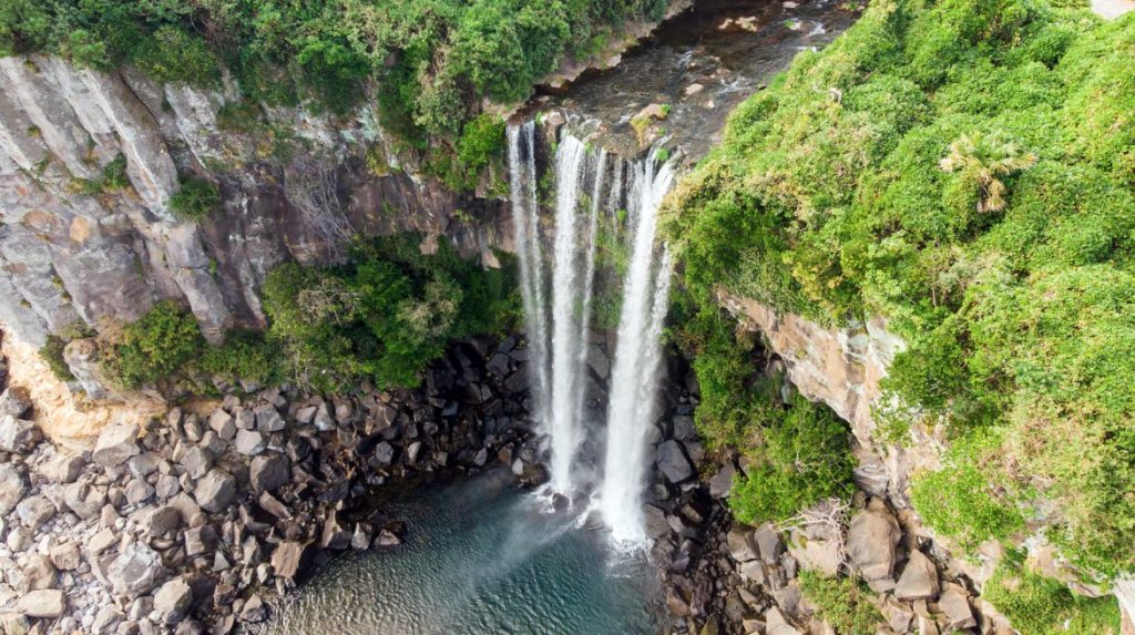 Unveil the Natural Beauty of Jeju Island, Captivating Cheonjiyeon Waterfall in Picturesque Splendor.